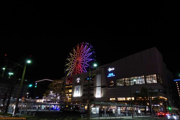 ferry wheel behind Kagoshima-Chuo Station at night